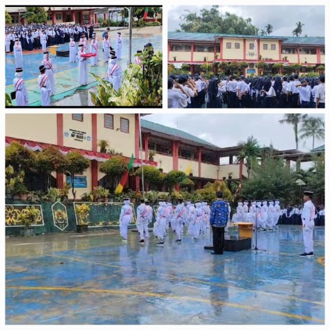 HUJAN, PENGIBARAN BENDERA JALAN TERUS